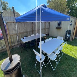 Tables and chairs with canopy