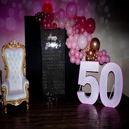 Balloons, pedestals, LED uplights, drapes, dance floor, etc