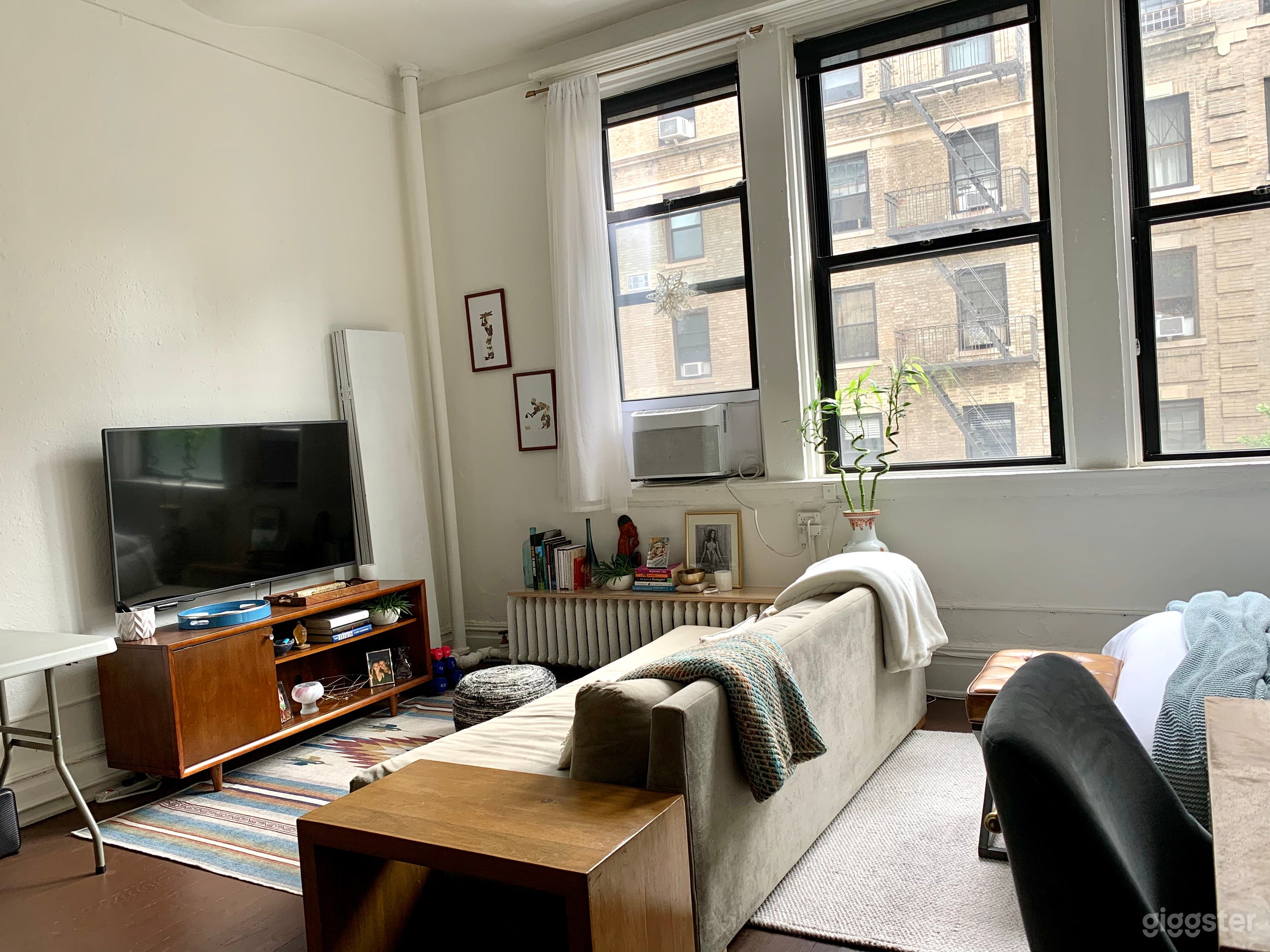 Accordion screen in the corner can be used to separate bed area.