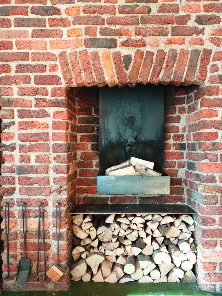  Reclaimed working original Victorian brick fireplace with modern steel open fire. 