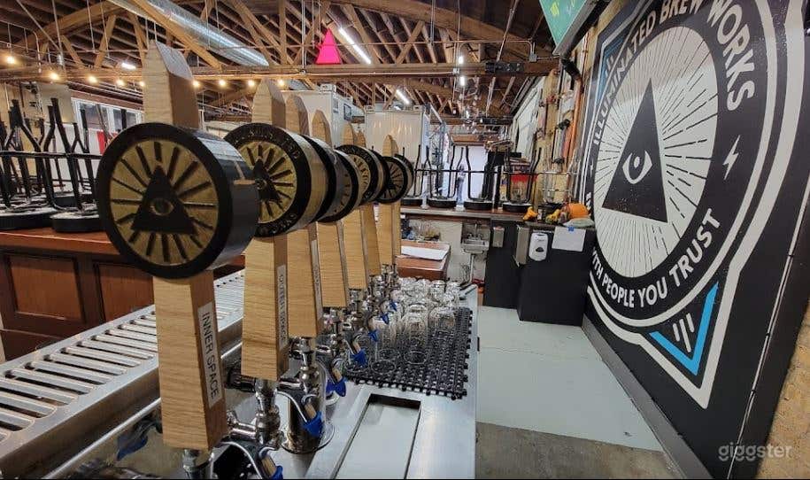 8 tap handles of Illuminated Brew Works beer.