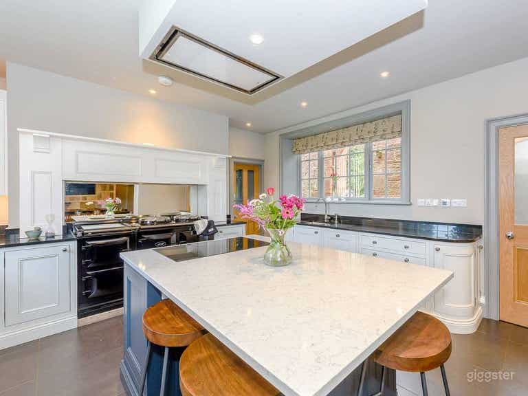  Kitchen with AGA cooker and marble island 