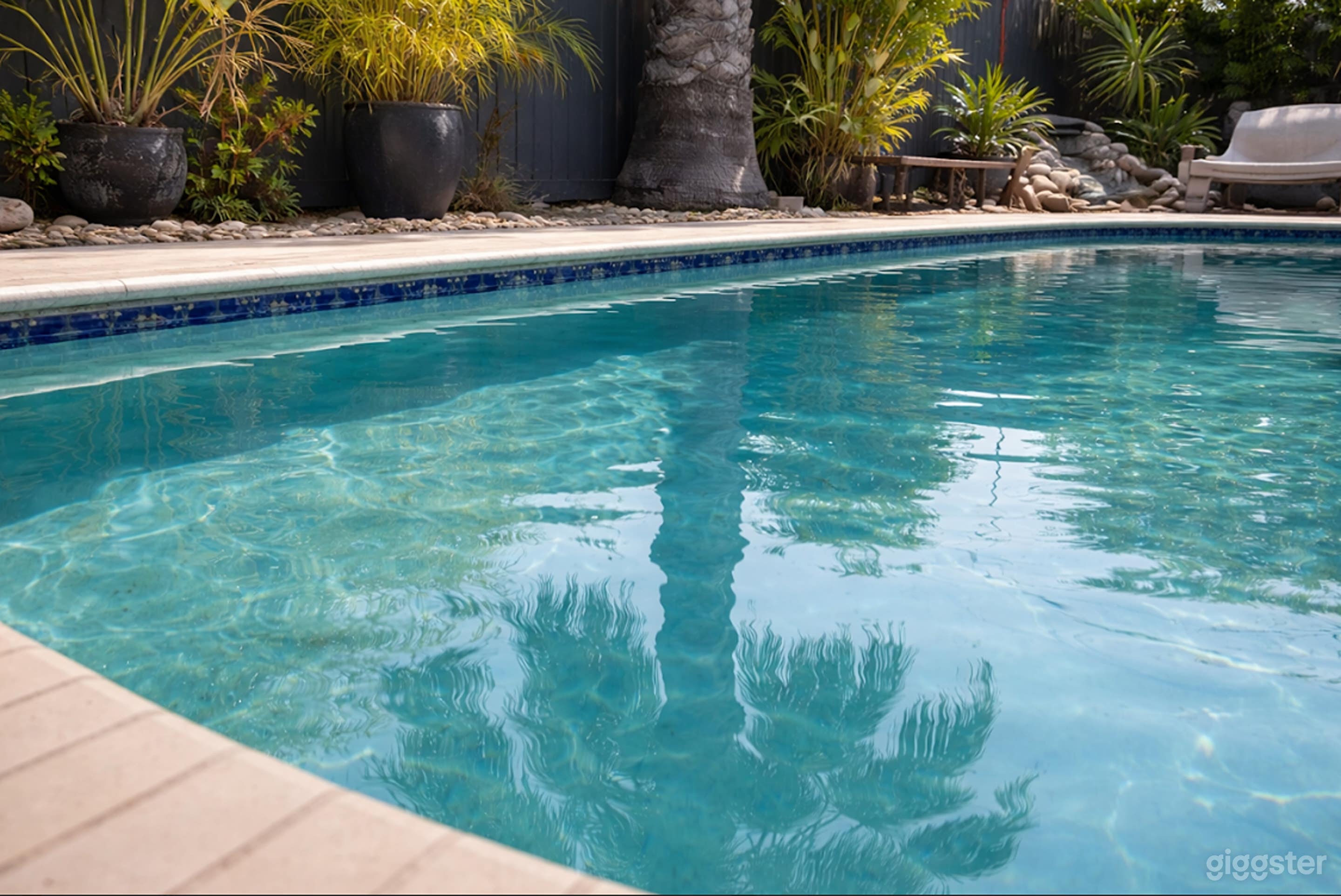 Tropical Private Pool with Waterfall & Lush Greenery Photo 3
