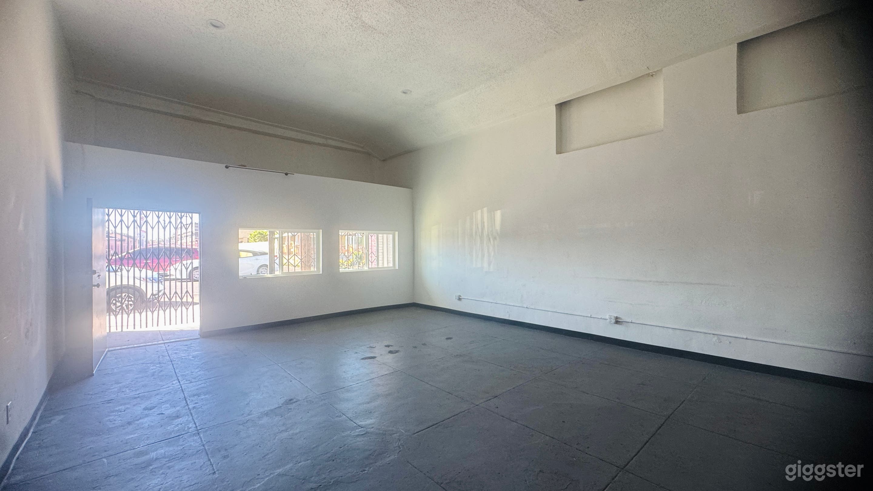 Empty Store Warehouse with Booths, Chairs Photo 3