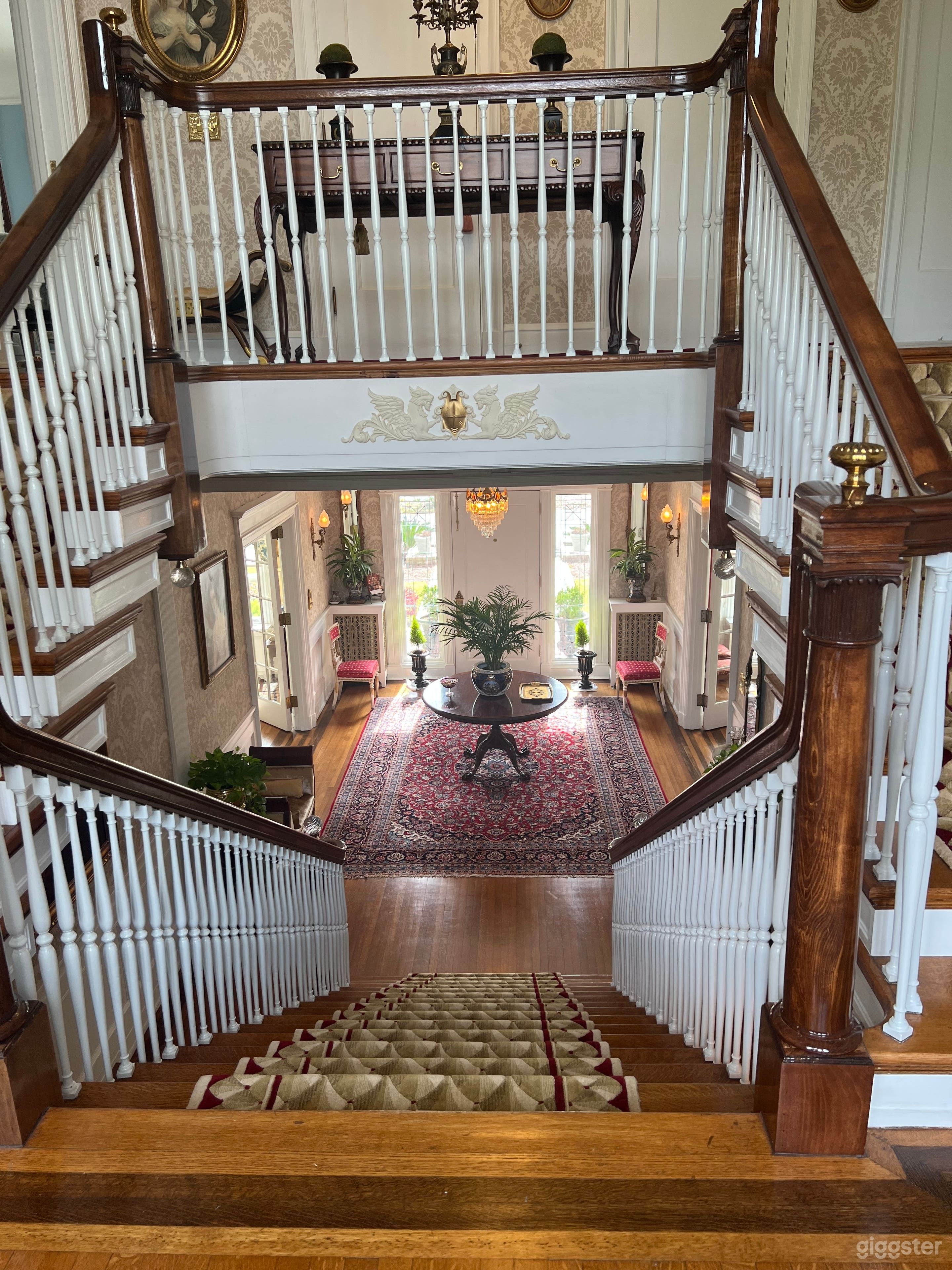 View of staircase from middle landing.  