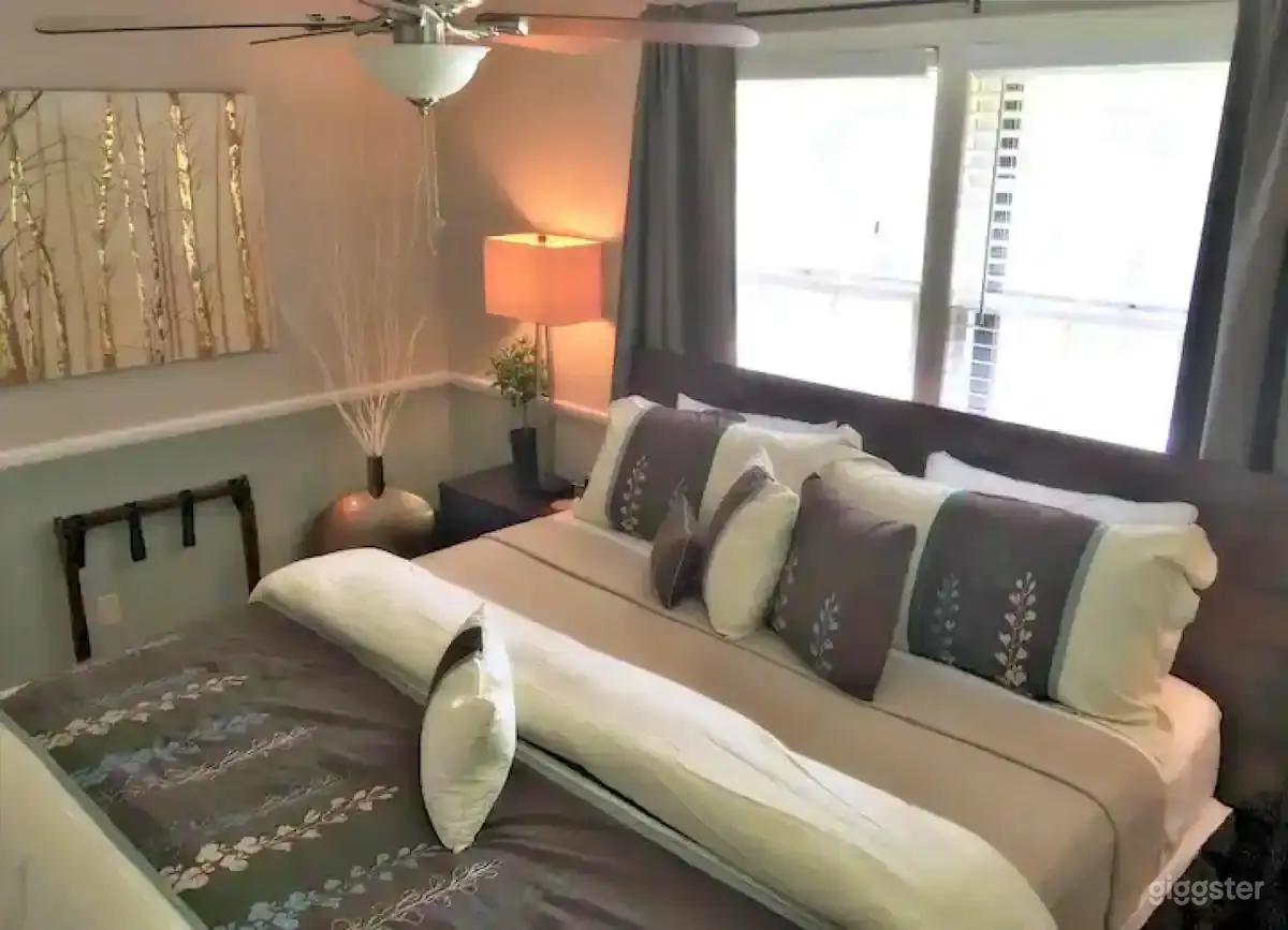 Master bedroom features a large king bed, 32" Smart TV, full length mirror and black out curtains.