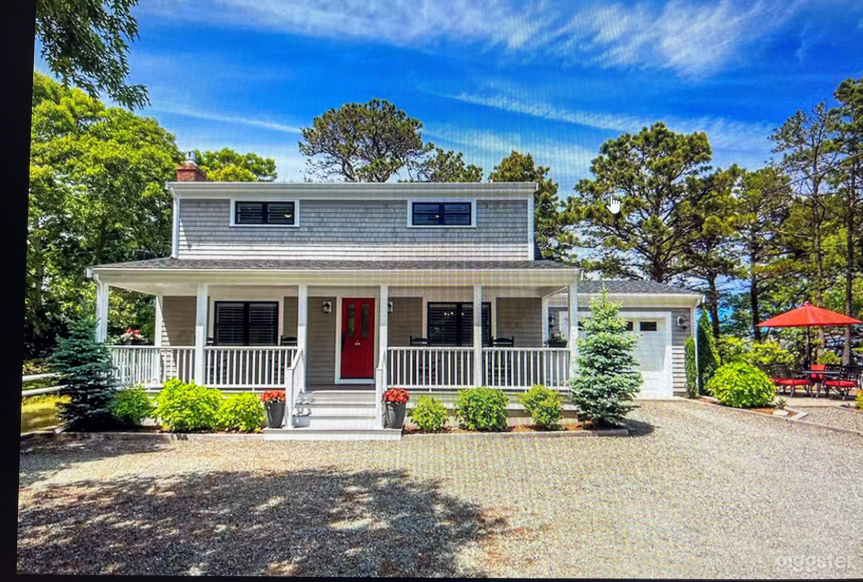 Front of House with Parking Area for 5 cars.  
