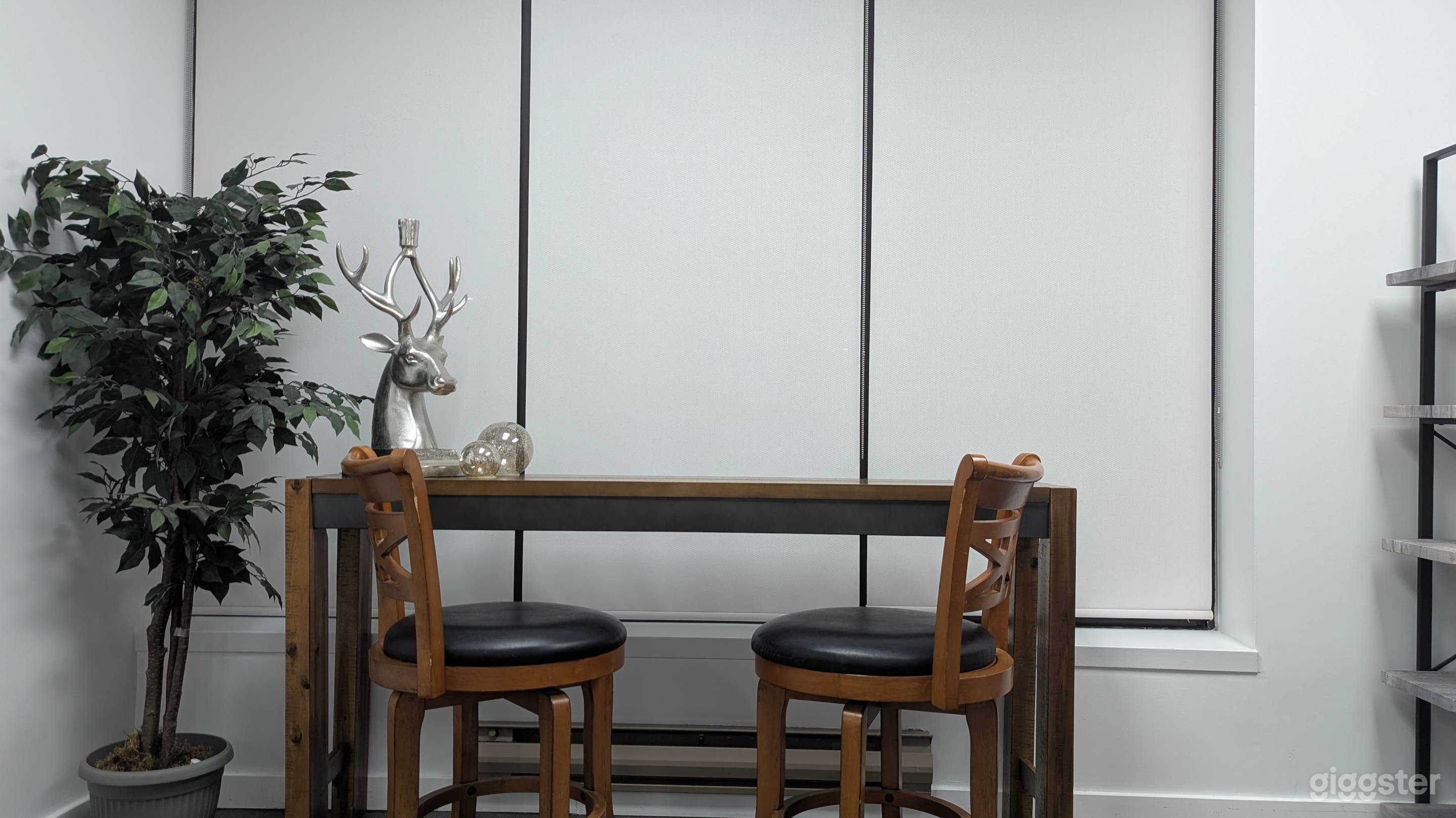 Table and chairs beside the window area