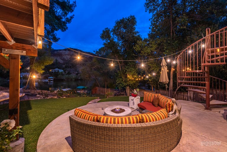  Circular patio with fire-pit, facing the water. 