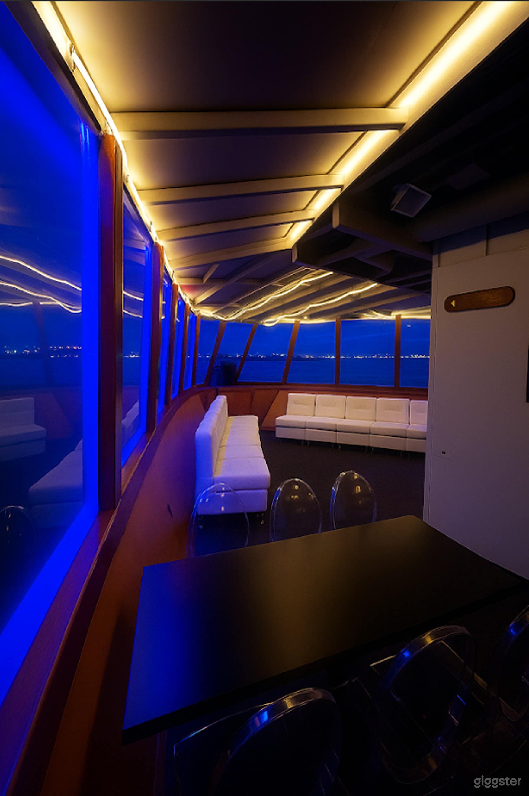 Spacious Main Deck with Dance Floor, Skyline Views &amp; Full AV Photo 2