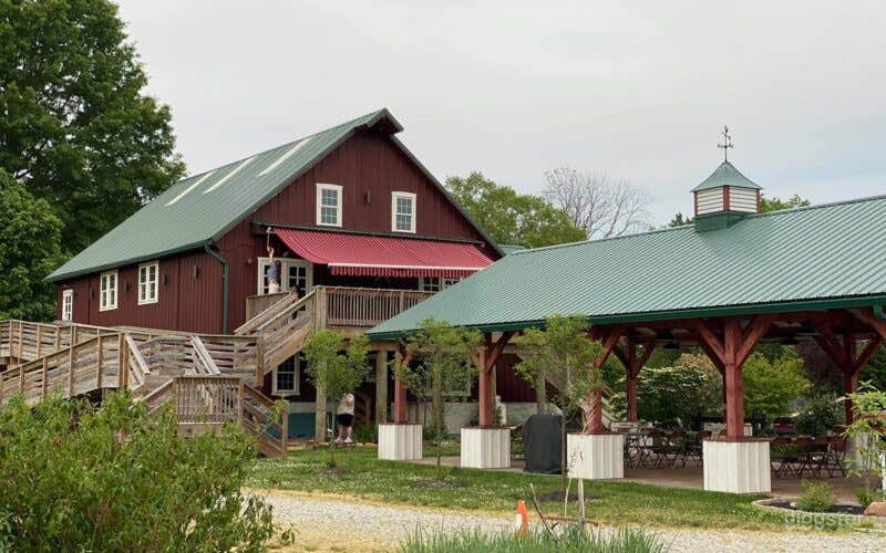 Side of barn showing pavilion and handicap ramp