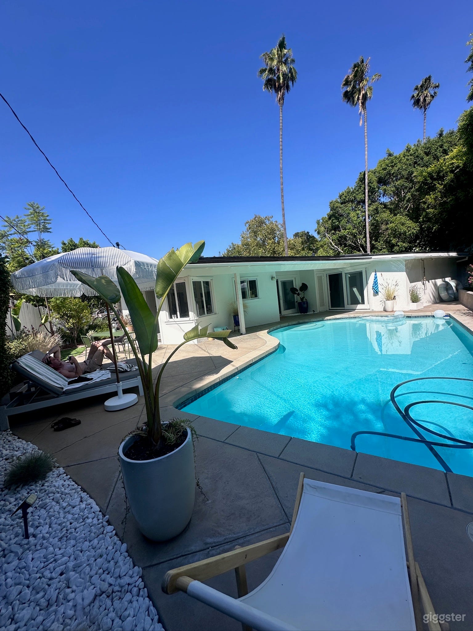 Large pool
Outdoor seating and tables
Outdoor shower
