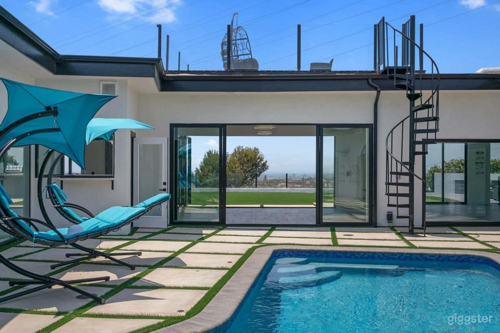 Iconic Poolside Oasis with Jaw-Dropping City View Photo 3