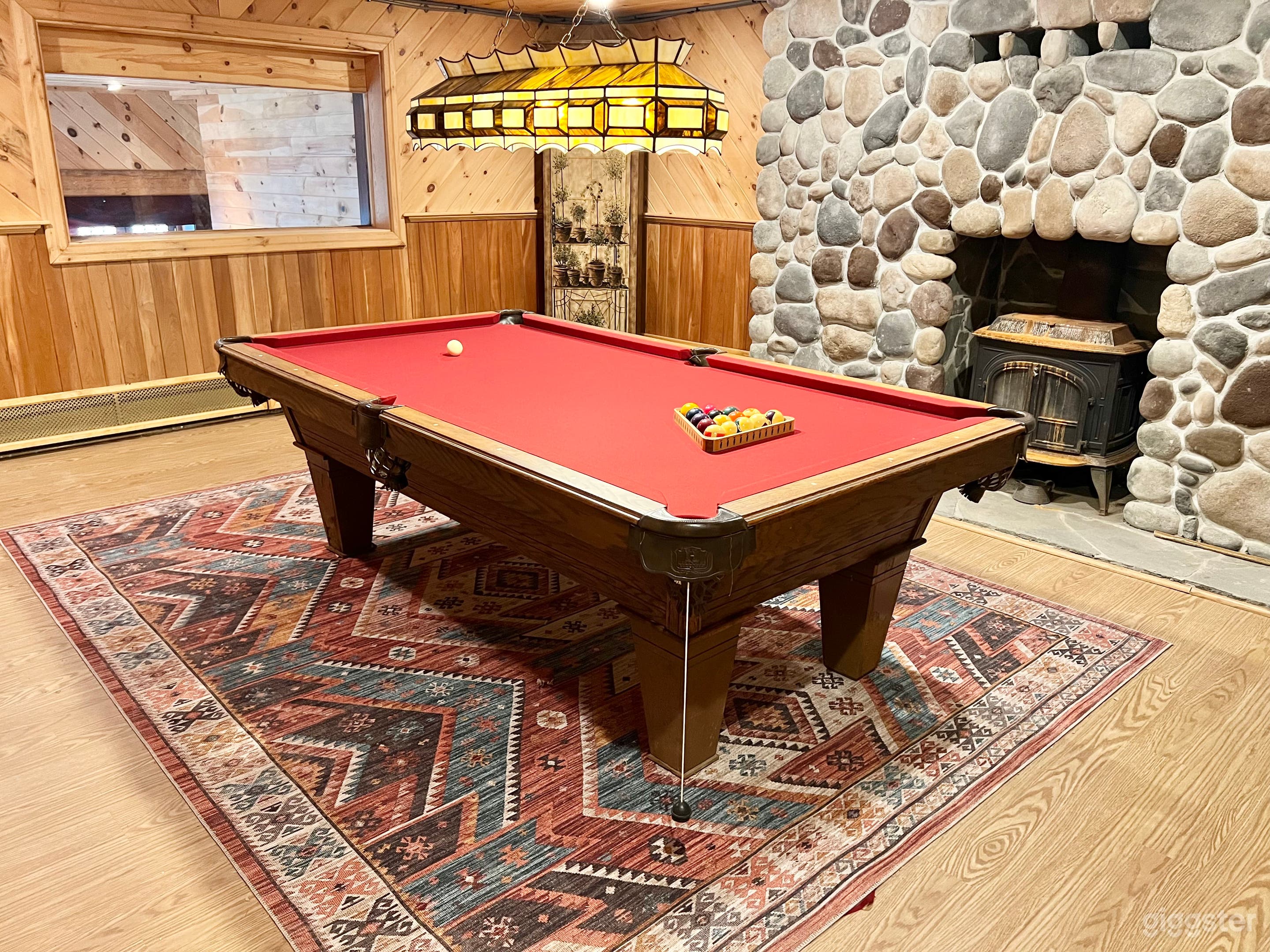 Billiards Room with stone fireplace