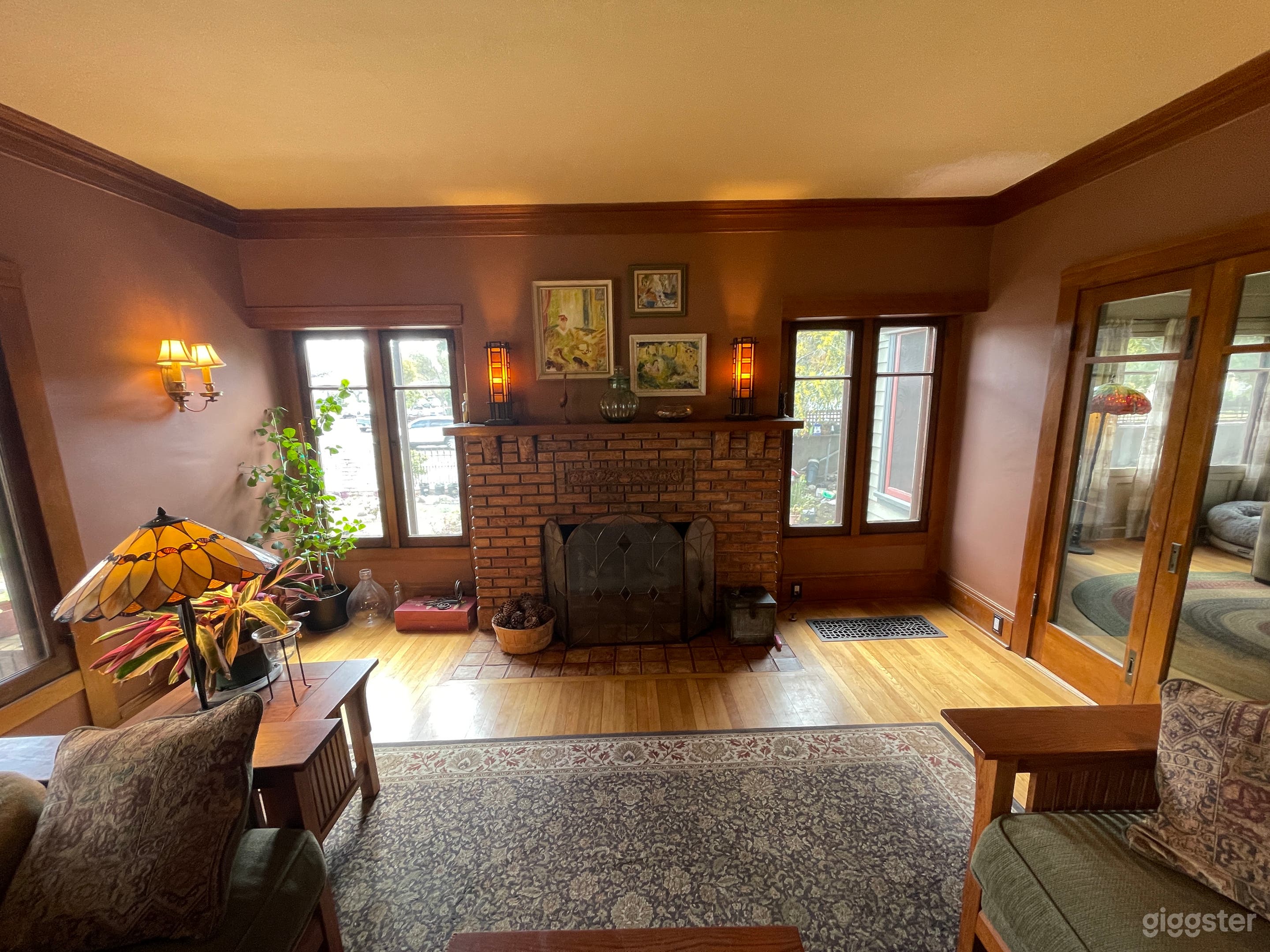 Living room with Batchelder fireplace. 