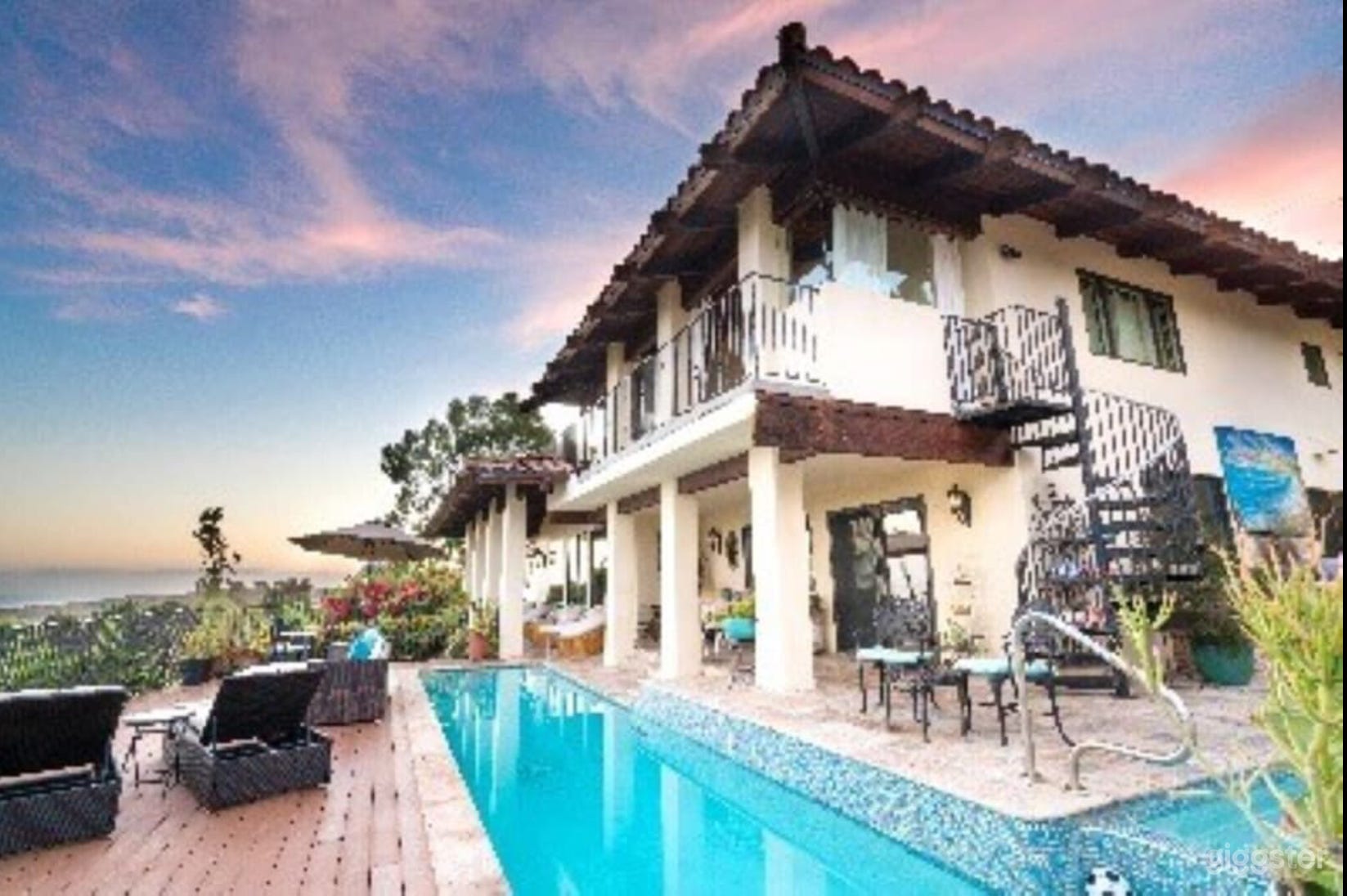 House, pool, spa and spiral staircase to the main bedroom and large balcony with an outdoor sleeping area.