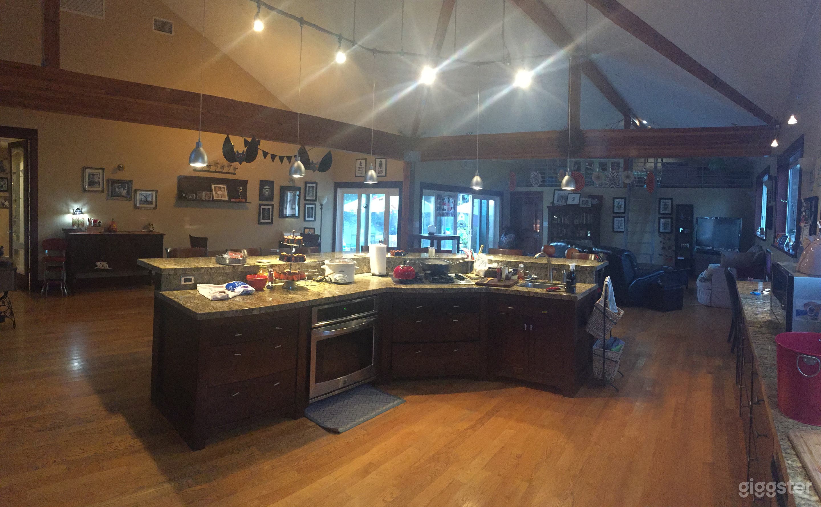 The main living area is spacious with pitched ceilings and includes the kitchen, dining room and living room. 