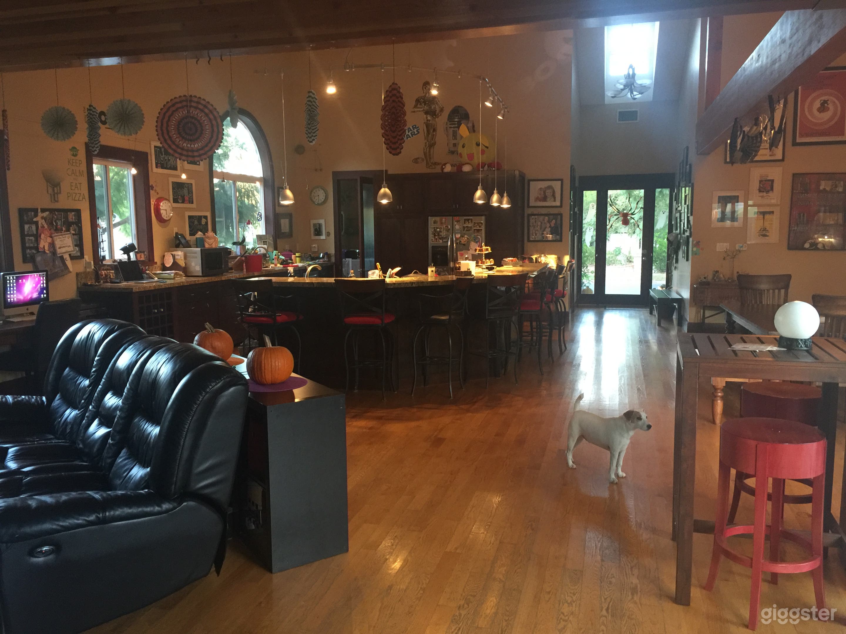 The main living area is spacious with pitched ceilings and includes the kitchen, dining room and living room. 