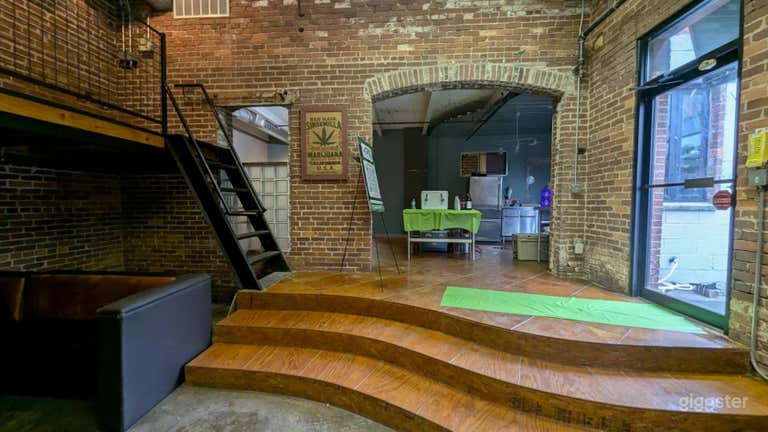  Main entrance and view of steps to balcony and adjacent kitchen. 