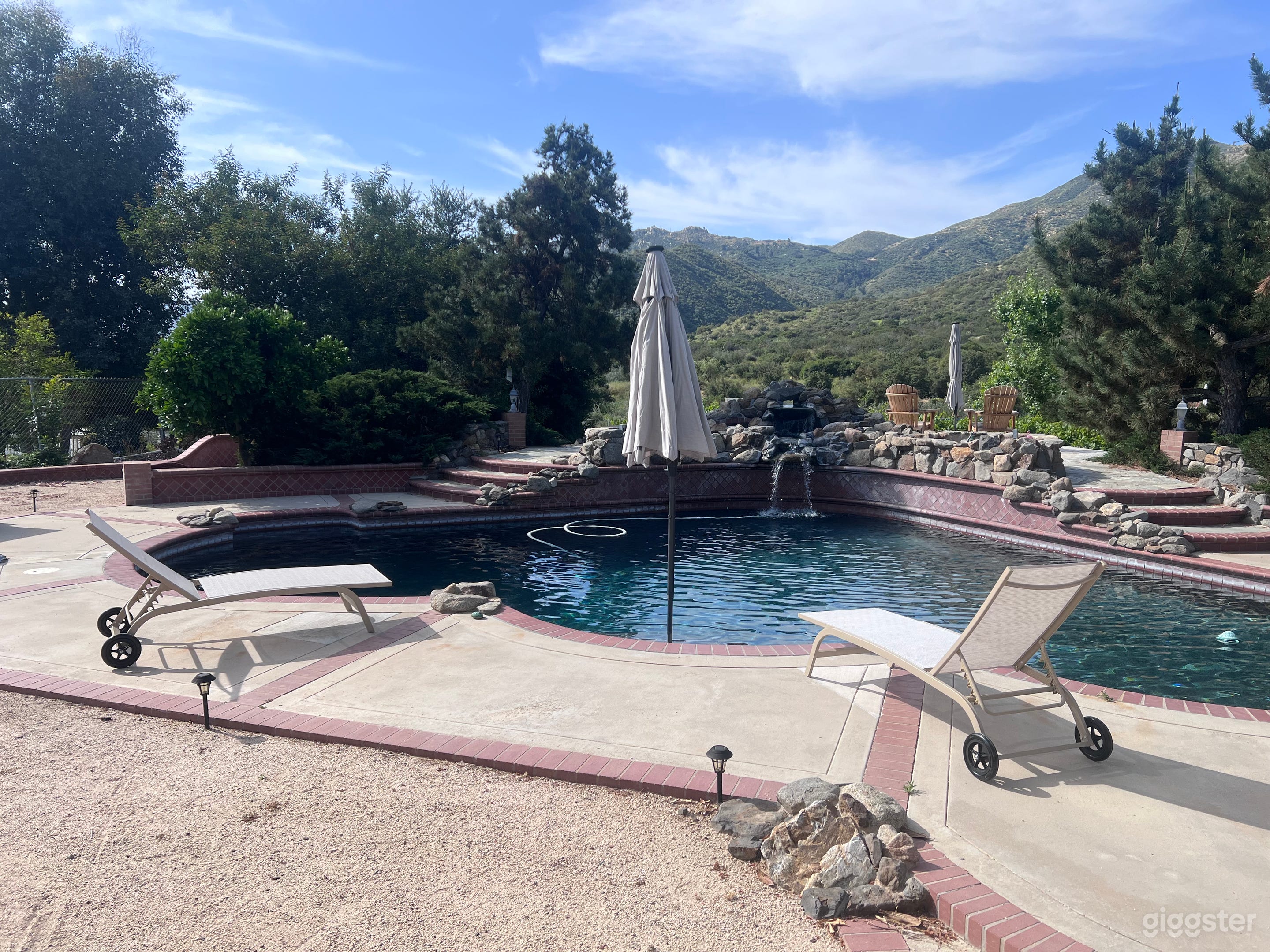 Secluded pool with rock waterfall Photo 4
