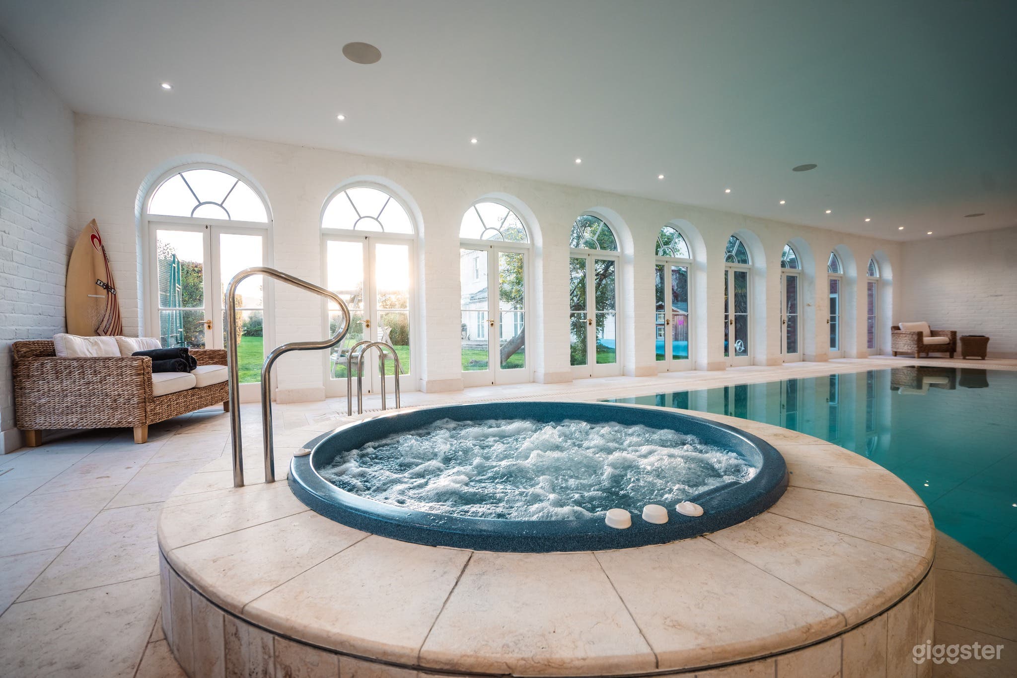 Tranquil Indoor Pool and Hot Tub with Abundant  Natural Lighting Photo 1