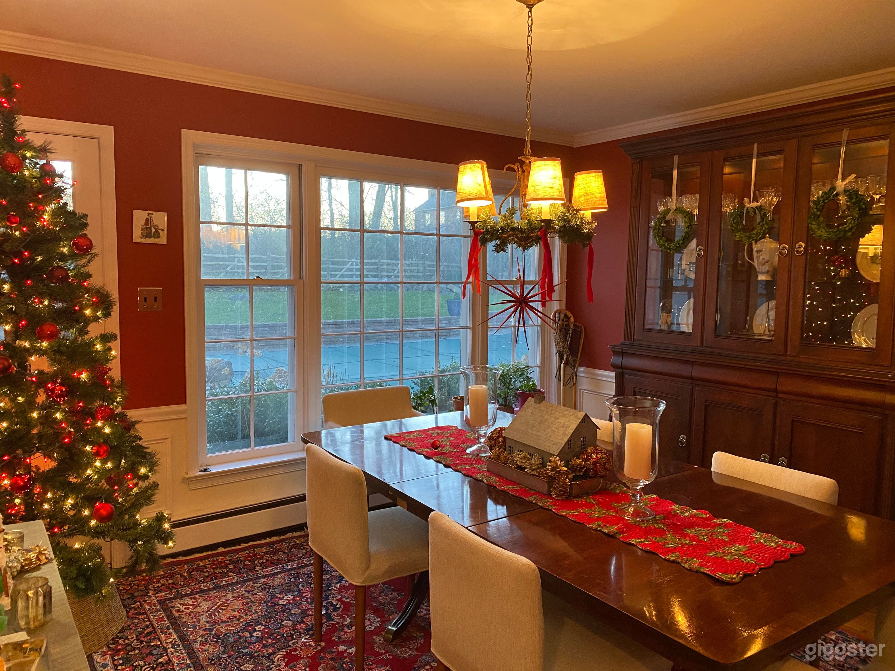 Dining room, seats ten comfortably, large picture window overlooking landscaping and saltwater pool/outdoor fireplace