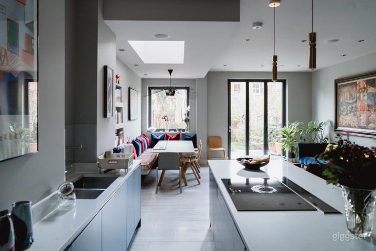  Kitchen open space with dining and sitting area view and bifold doors. 