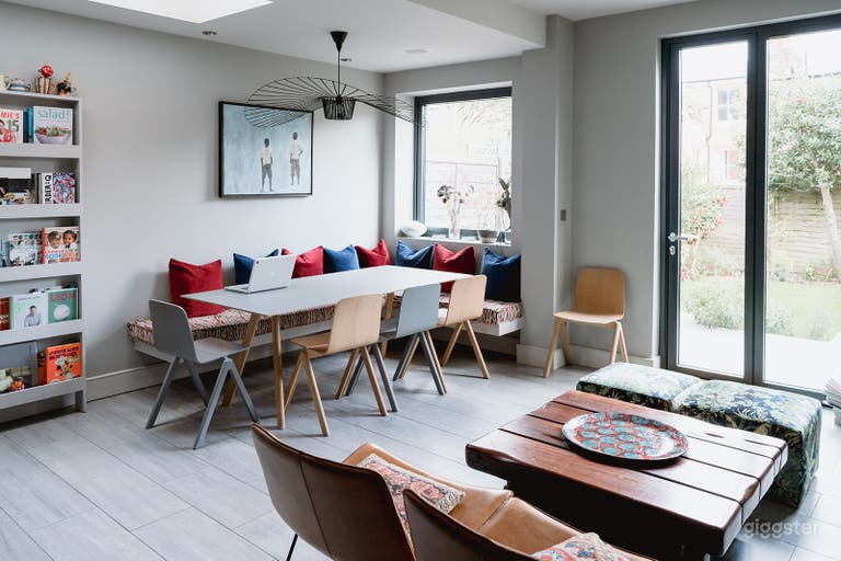  Kitchen open space with dining area, sitting area featuring a solid wood coffee table. 