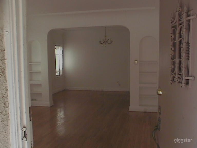  Unfurnish version of front door, enter living room, to dining room. Built in arch and bookcases. Origonal hardwood floors from the 1927&#x27;ish 