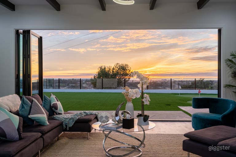  Sunset View: Living room #2 with infinity breathtaking Sunset Views to Backyard, Ocean and City through Large Bifolding Glass Doors 