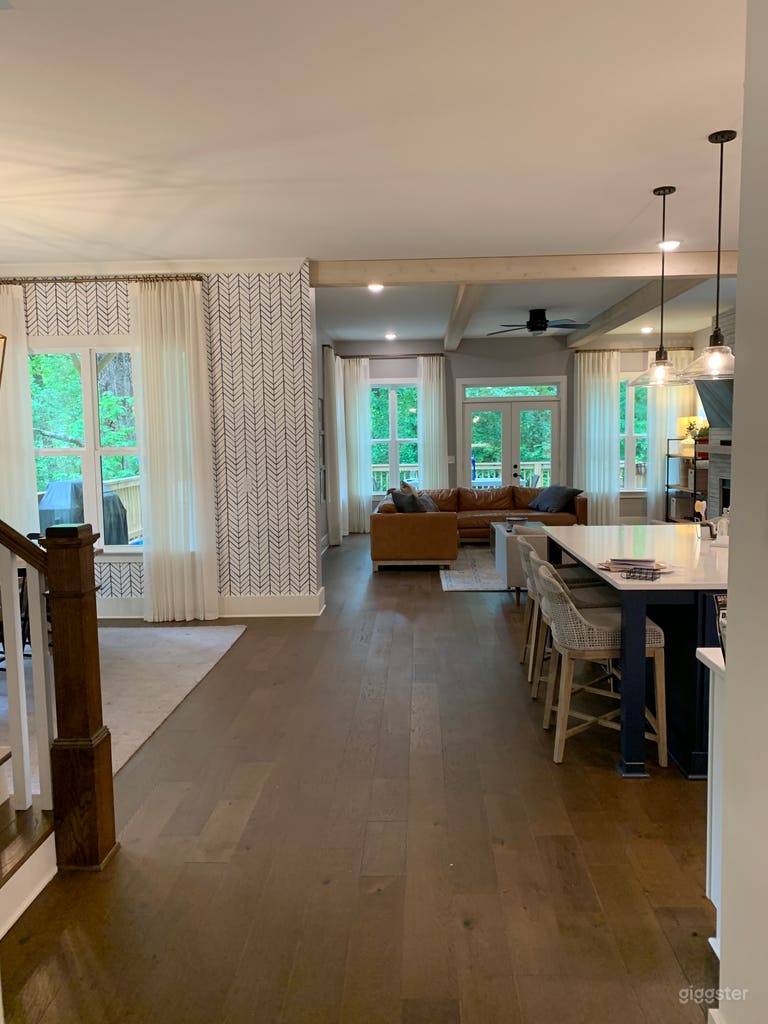  Wide View of open concept kitchen/living/dining area with back to front door 
