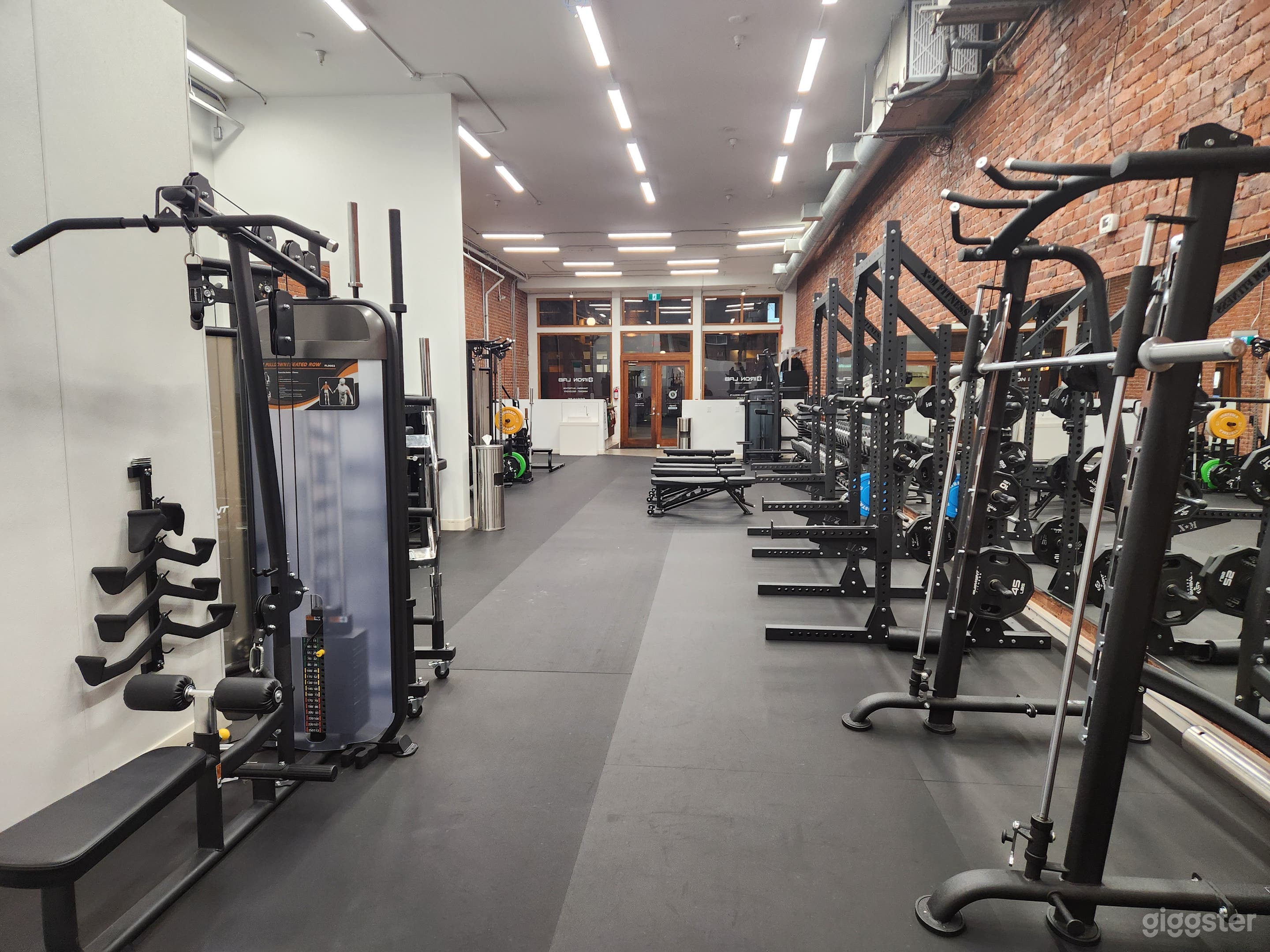 Industrial Fitness Studio with Exposed Brick &amp; High Ceilings Photo 2