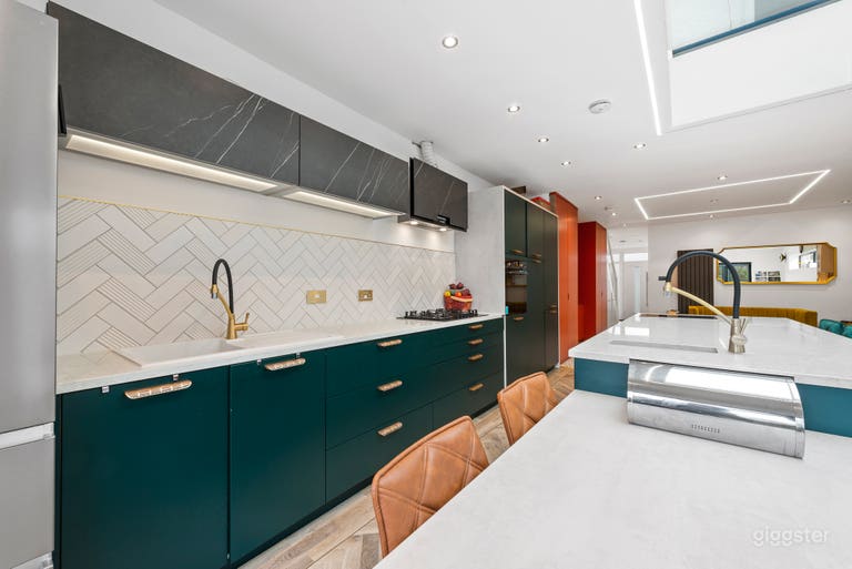  High-end German kitchen with karndean design flooring and luxury kitchen island with appliance underneath it (including a touch-triggered microwave and induction and gas hob) 
