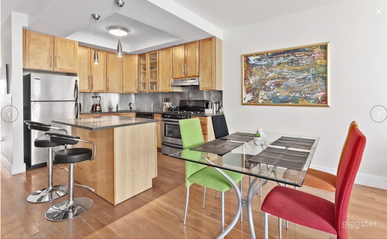  Dinning room area with island kitchen with stainless steel appliances, granite counter tops and wooded cabinets  