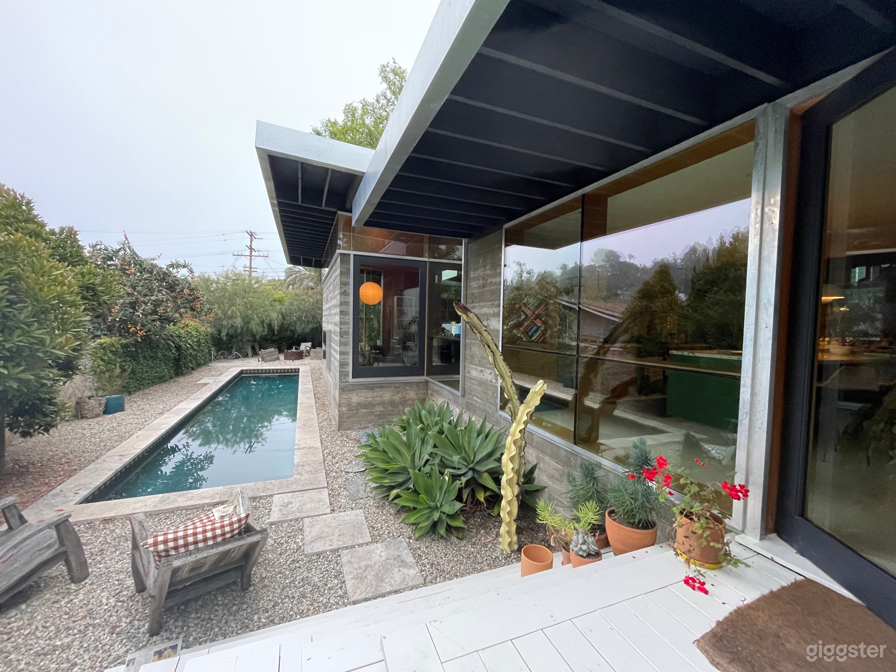 View of pool and house from side porch. 