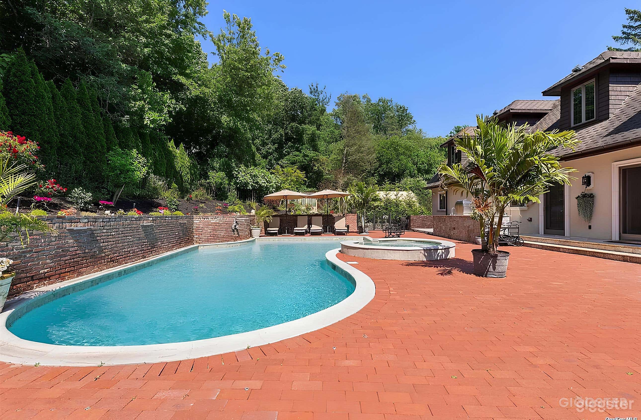 heated pool with waterfall and hot tub Private