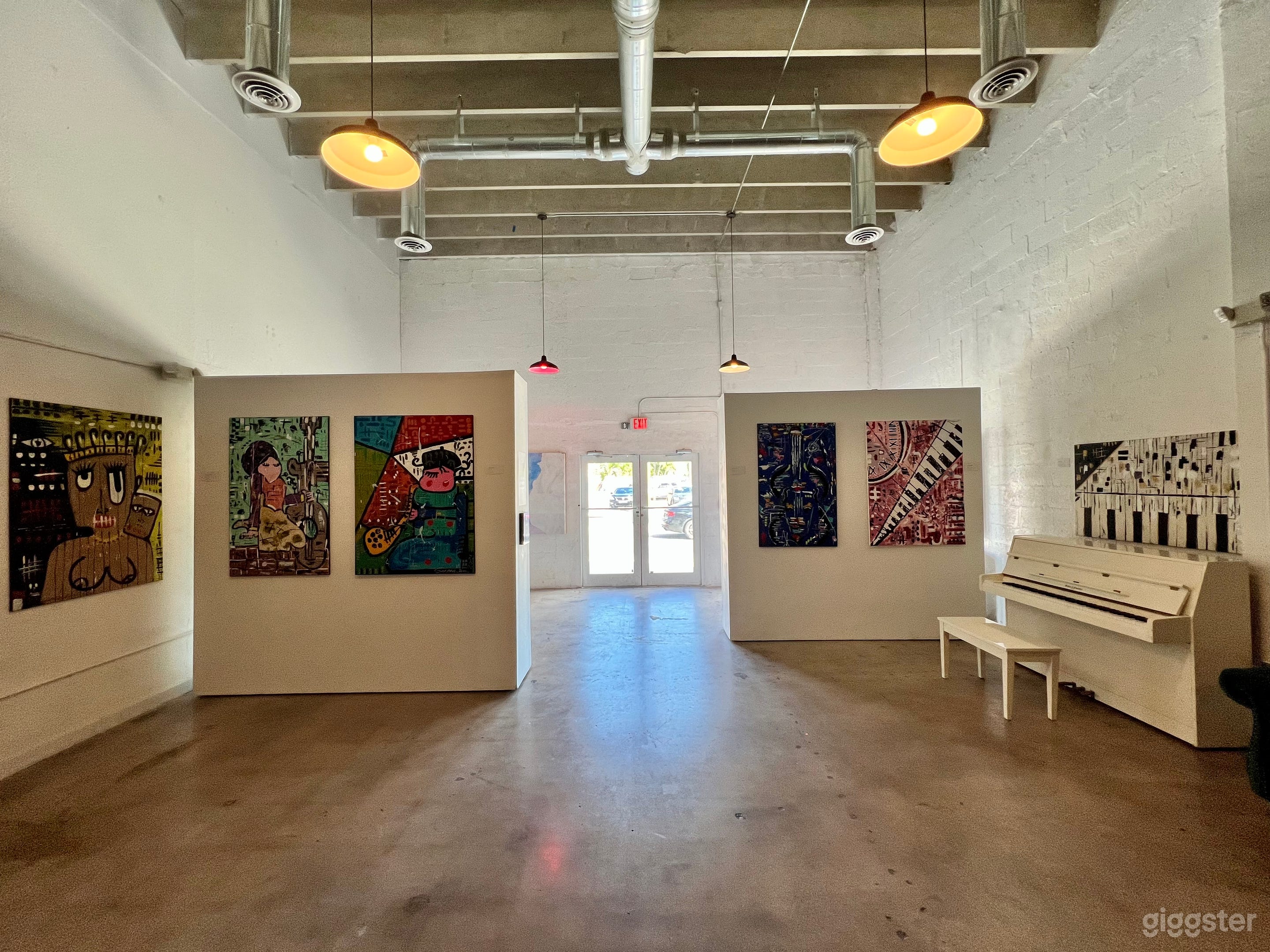 The interior has good natural light as well as overhead lighting. The two art walls are on wheels and can be placed wherever you would like