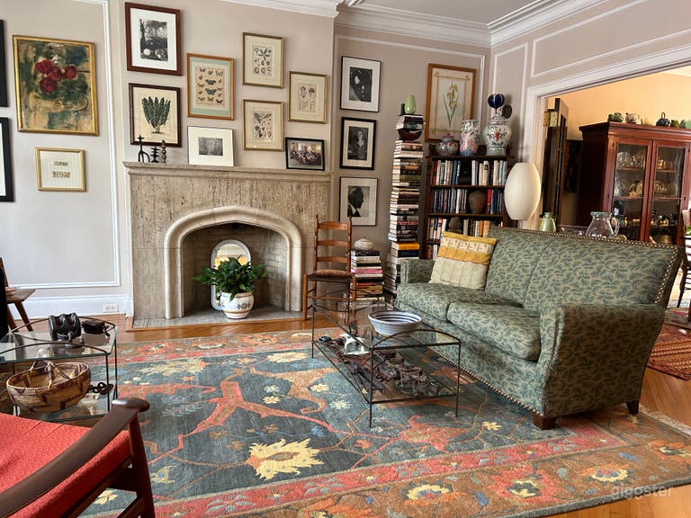  Living room with fireplace, beautiful moulding and beveled glass doors. 