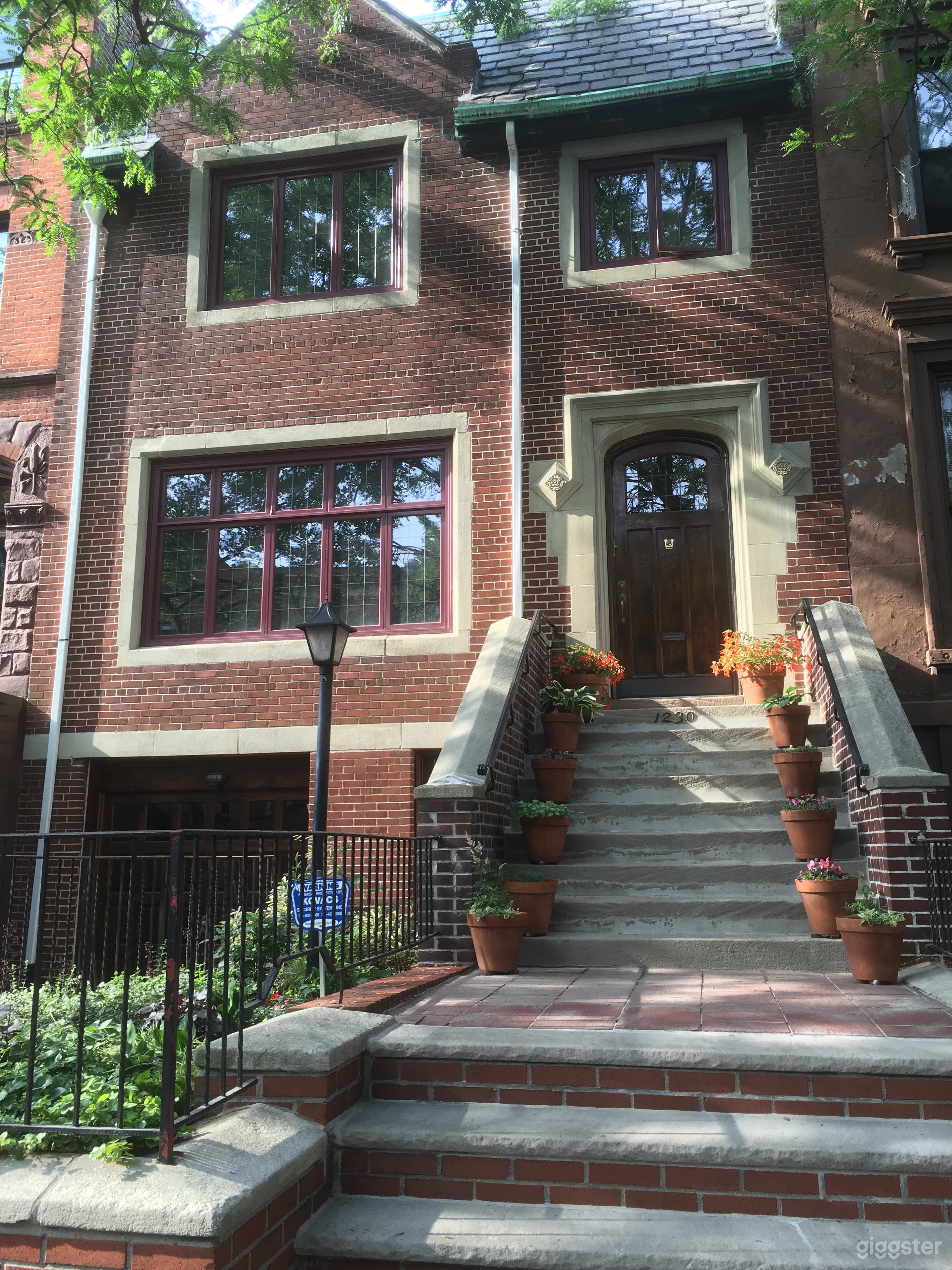 Extra-wide, 25-foot brick townhouse on landmarked Brooklyn street.
