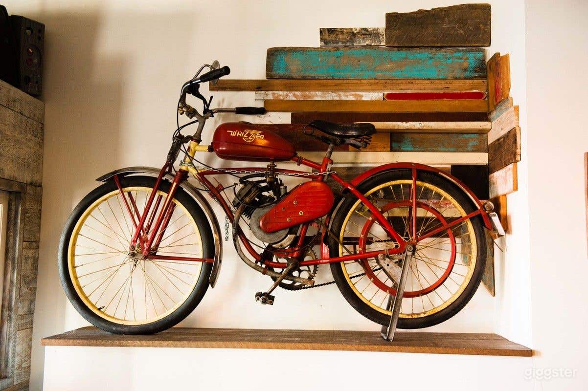 Whizzer along the bench seating towards front of restaurant.