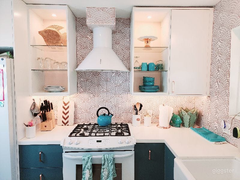 Kitchen -- Stove, Oven, Shelving. 
Seashell Backsplash