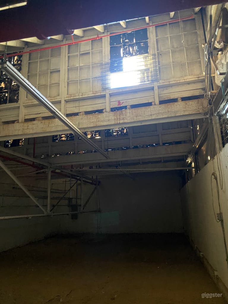  3000 Sqft raw industrial room with sawtooth windows 