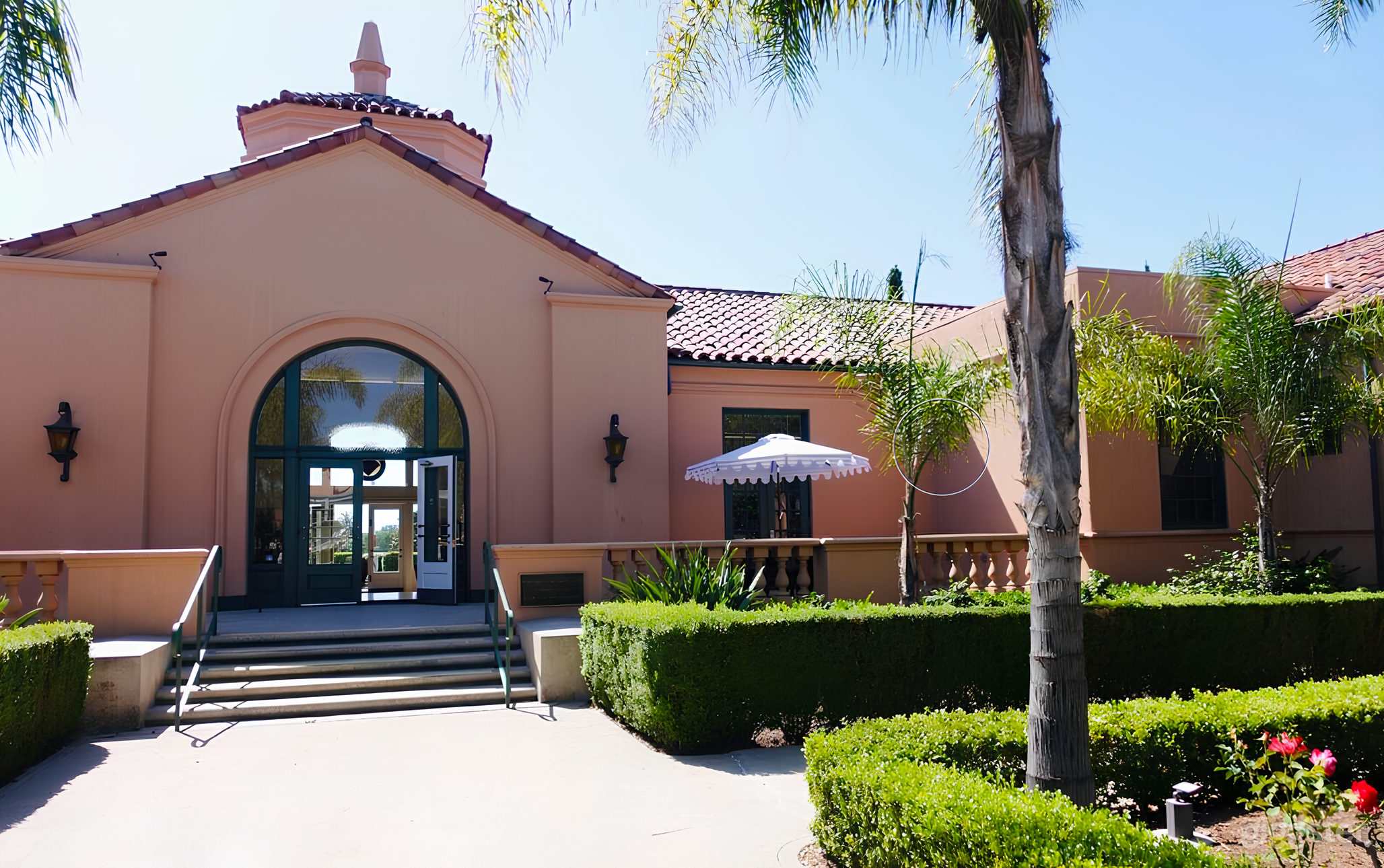 Back side of our venue from within the rose garden looking at the patio. 