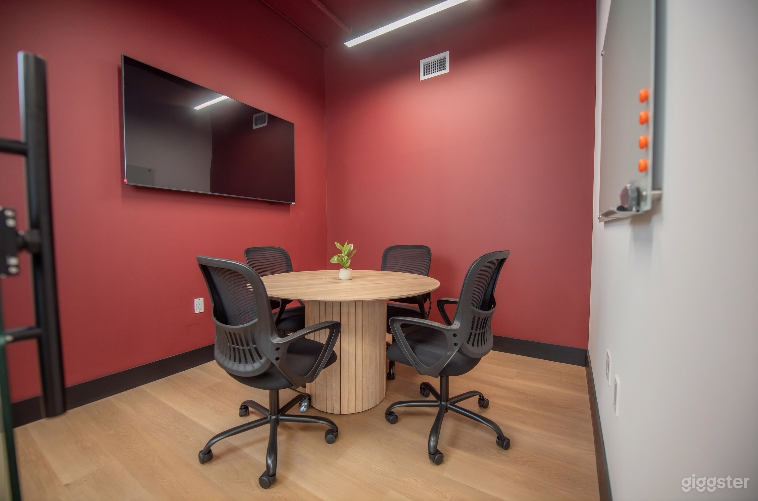 Modern 4 Person Meeting Room with Screen in Miami! Photo 1
