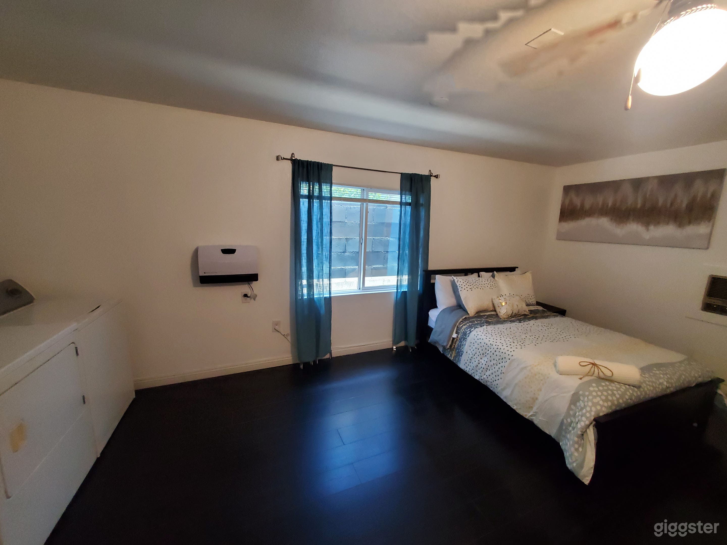 Tinted window. Queen size bed and laundry units
