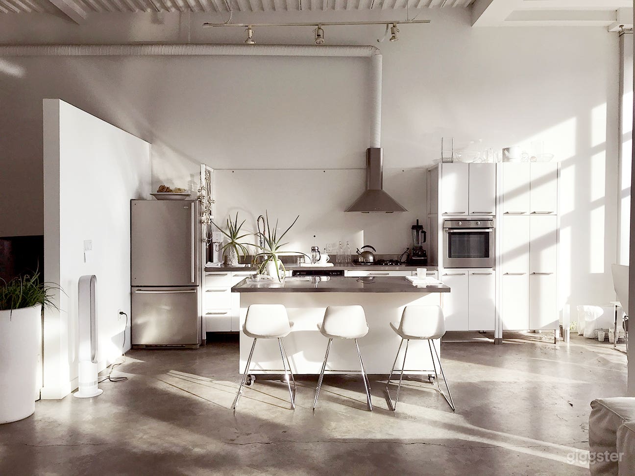Kitchen area sets the tone for lifestyle images. Island is on wheels and movable. 