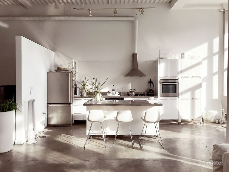  Kitchen area sets the tone for lifestyle images. Island is on wheels and movable.  
