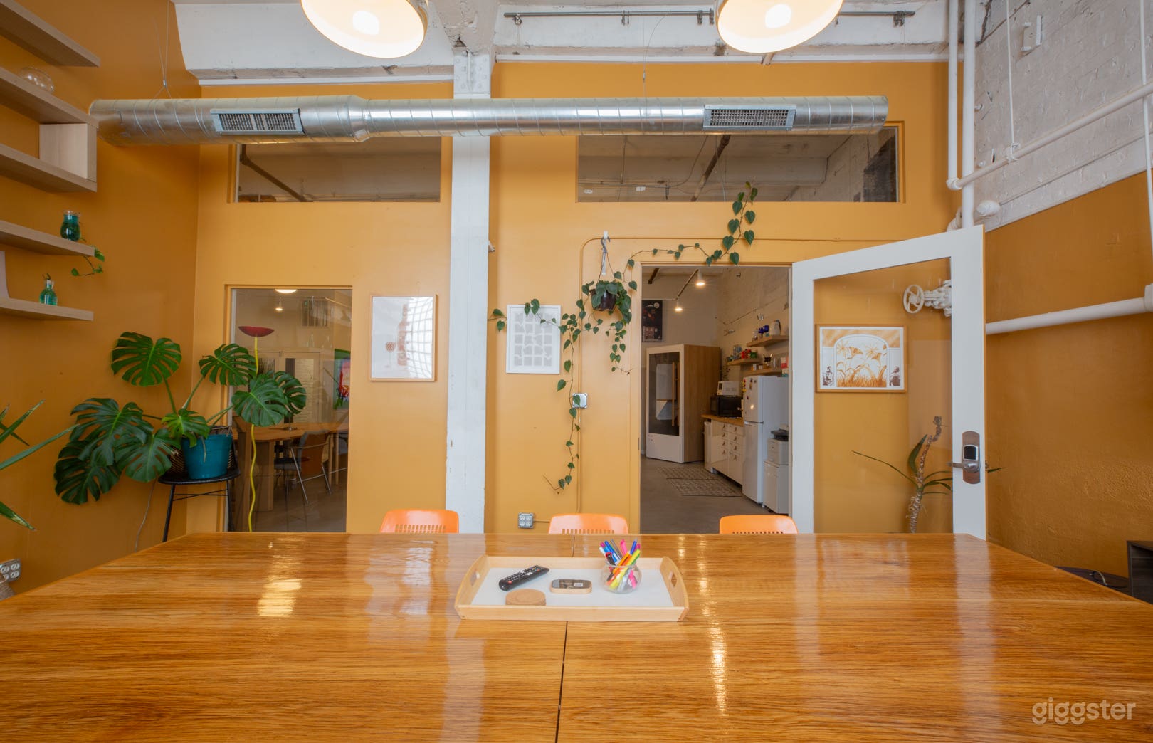 Lush live greenery fills the room, completing the space.