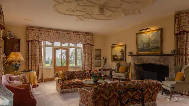  The drawing room with original tudor ceiling and stone fireplace (working). 