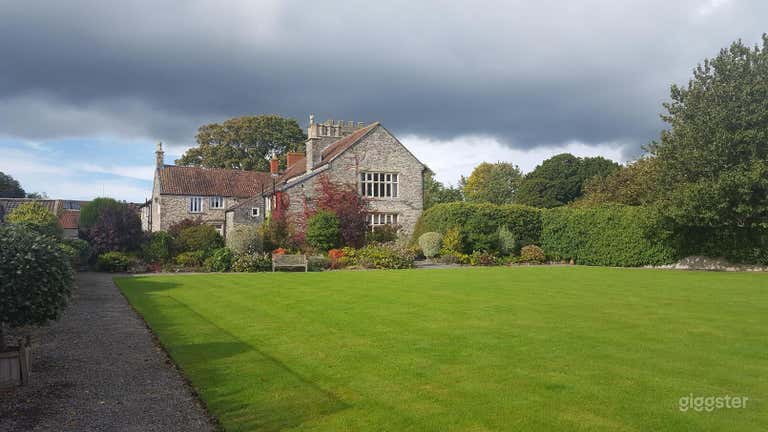  View of the South aspect of the house seen from the croquet lawn (50&#x27; x 45&#x27;) with ornamental shrubs. 